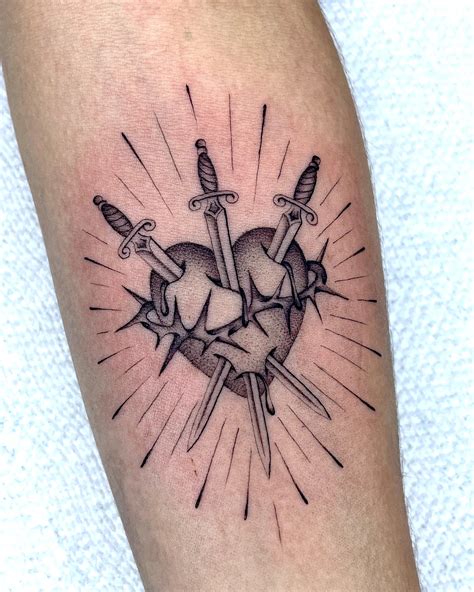 16 Bold Dagger Through A Heart Tattoo Ideas You Ll Love 16 Bold Dagger Through A Heart Tattoo Ideas You Ll Love