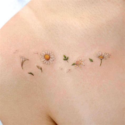 22 A Tattoo Of Daisies Lilies And Petals Daisy Tattoo Designs 22 A Tattoo Of Daisies Lilies And Petals Daisy Tattoo Designs