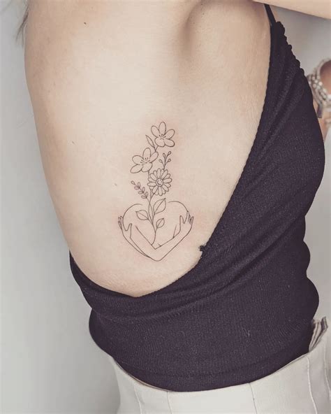 25 Attractive Rib Tattoo Designs 25 Attractive Rib Tattoo Designs