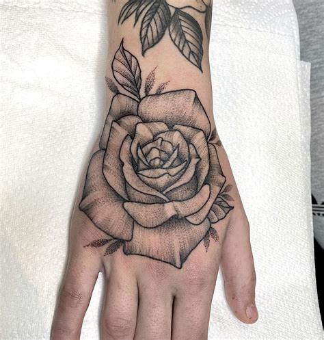 25 Beautiful Hand Tattoo Ideas Rose Amp Patience I Take You Haircuts
