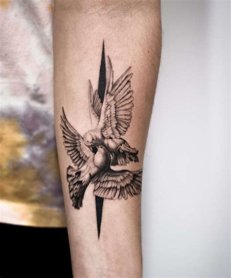 A Black And White Tattoo With A Cross Doves And A Bird On It
