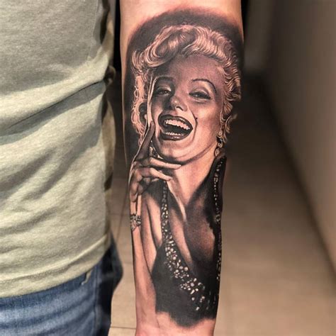 Black And Grey Marilyn Monroe Portrait Tattoo Located