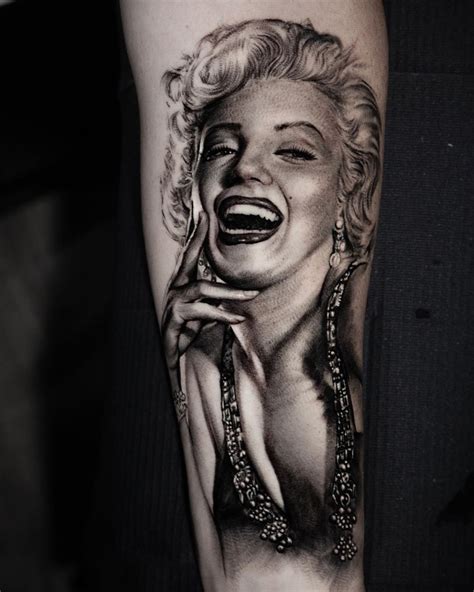 Black And Grey Marilyn Monroe Portrait Tattoo On The