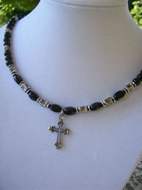 Cross Tattoo With Black Beads And Silver Ribbon