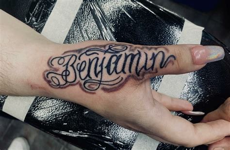Hand Name Tattoo Designs