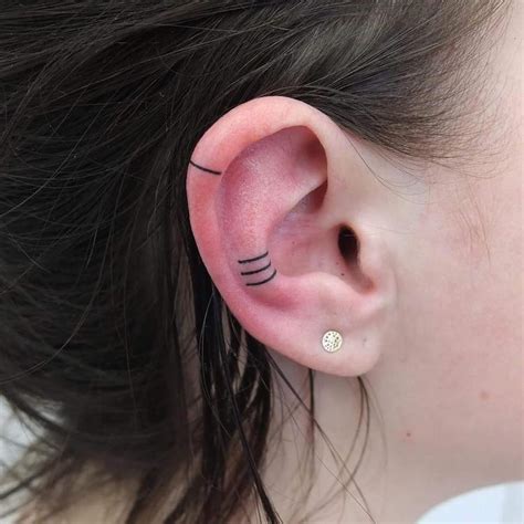 Minimalist Ear Tattoo Trend Has People Getting Tiny Tattoos On Ear
