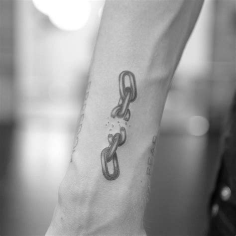 Single Needle Broken Chain Tattoo Located On The Wrist