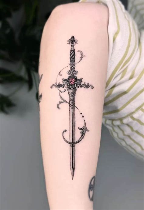 Sword Tattoo Designs For Women Sword Tattoo Designs For Women