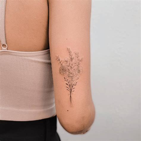 Tattoo Of A Fine Line Flower Bouquet Located On The Tattoo Of A Fine Line Flower Bouquet Located On The